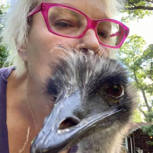 Kymara Longeran headshot with an emu's face also in frame